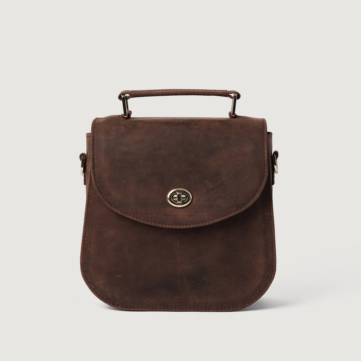 
The Sandra Vintage Distressed Brown Leather Saddle Bag For Women - Profil anësor i strukturuar me thellësi dhe vëllim